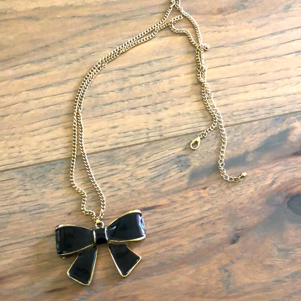 Black bow necklace on a silver chain
